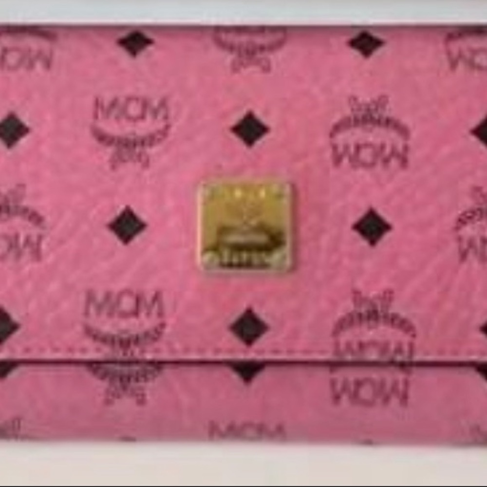 In fair condition. MCM long wallet logo total pattern pink leather & gold logo.